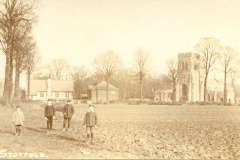 old photo of the church across fields